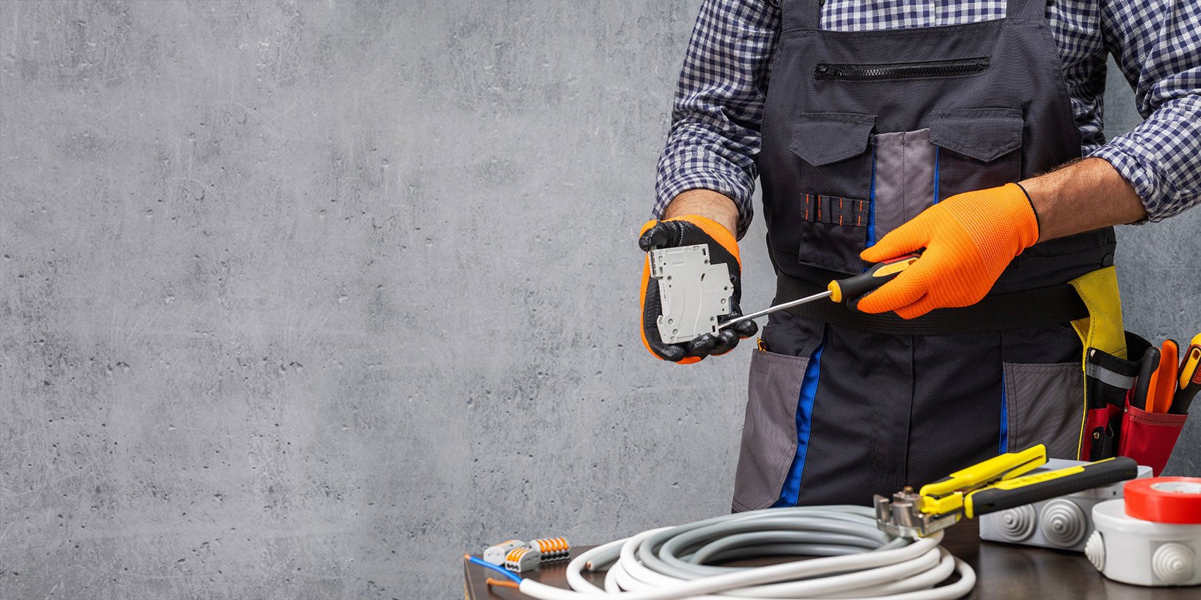 Electrician installing energy-saving equipment
